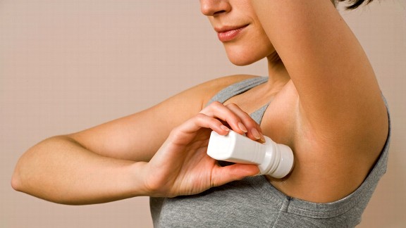 Woman applying aluminum-free deodorant
