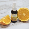 Vitamin C Face Oil on Counter with Orange